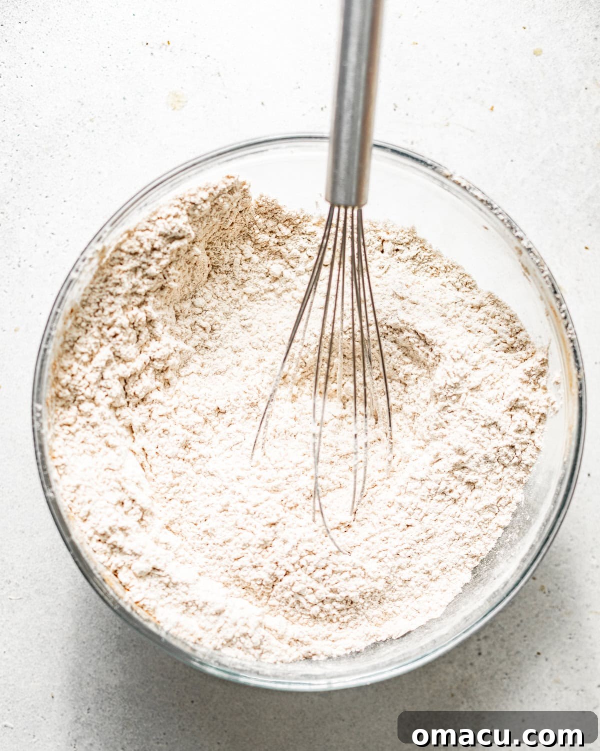 All-purpose flour, cornstarch, baking powder, and kosher salt whisked together in a bowl for the dredge.