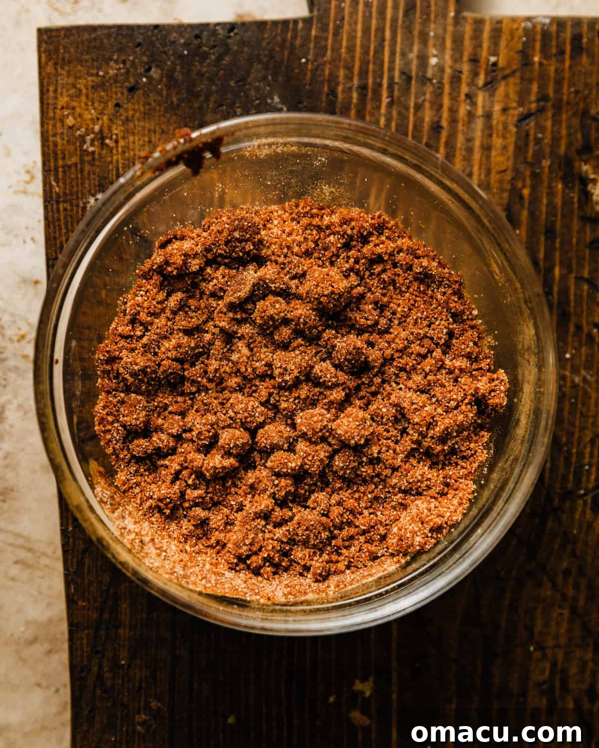 Cinnamon streusel mixture in a bowl, showing its crumbly texture.
