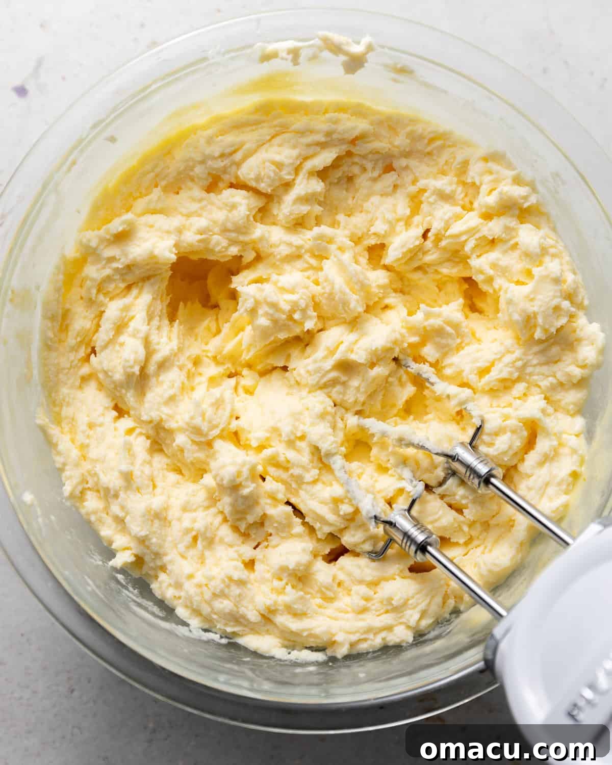 The smooth and creamy mascarpone mixture in a mixing bowl, ready to be layered into the tiramisu.