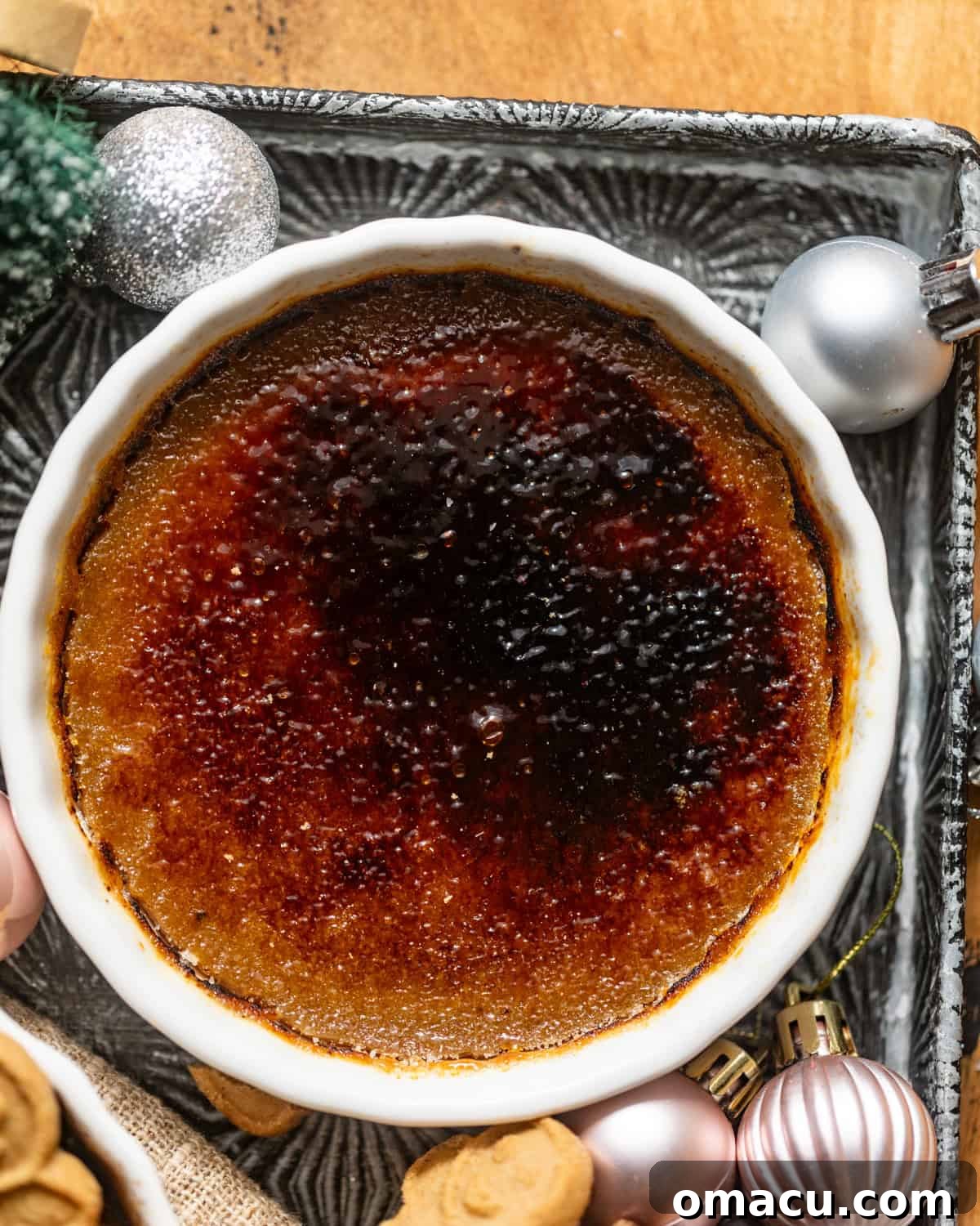 gingerbread creme brulee in a ramekin with the bruleed sugar topping.
