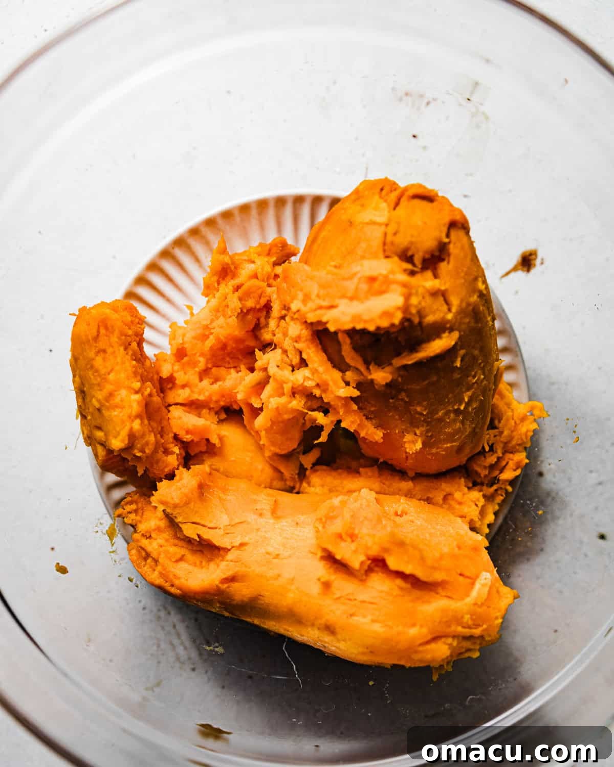 Mashed sweet potatoes in a bowl, showing a smooth and creamy texture.