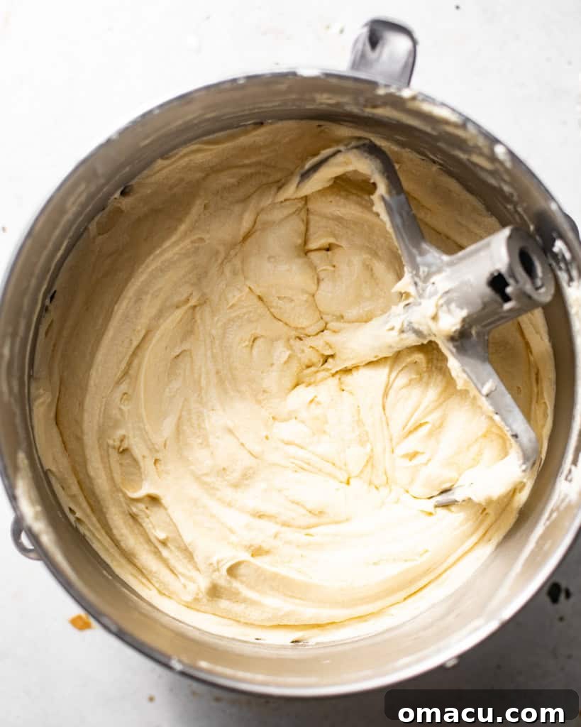 The fully assembled pound cake batter, smooth and ready, in a large mixing bowl.