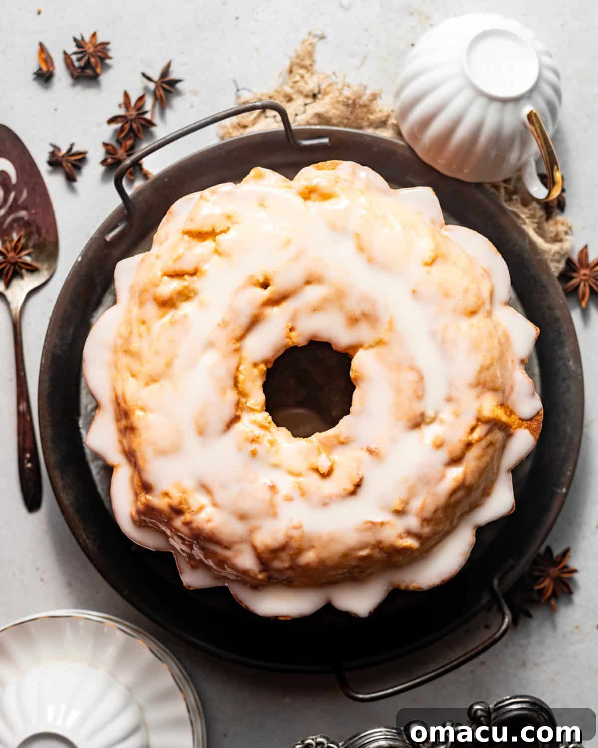 donut cake on a serving platter with tea cups.