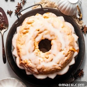 donut cake on a serving platter with tea cups.