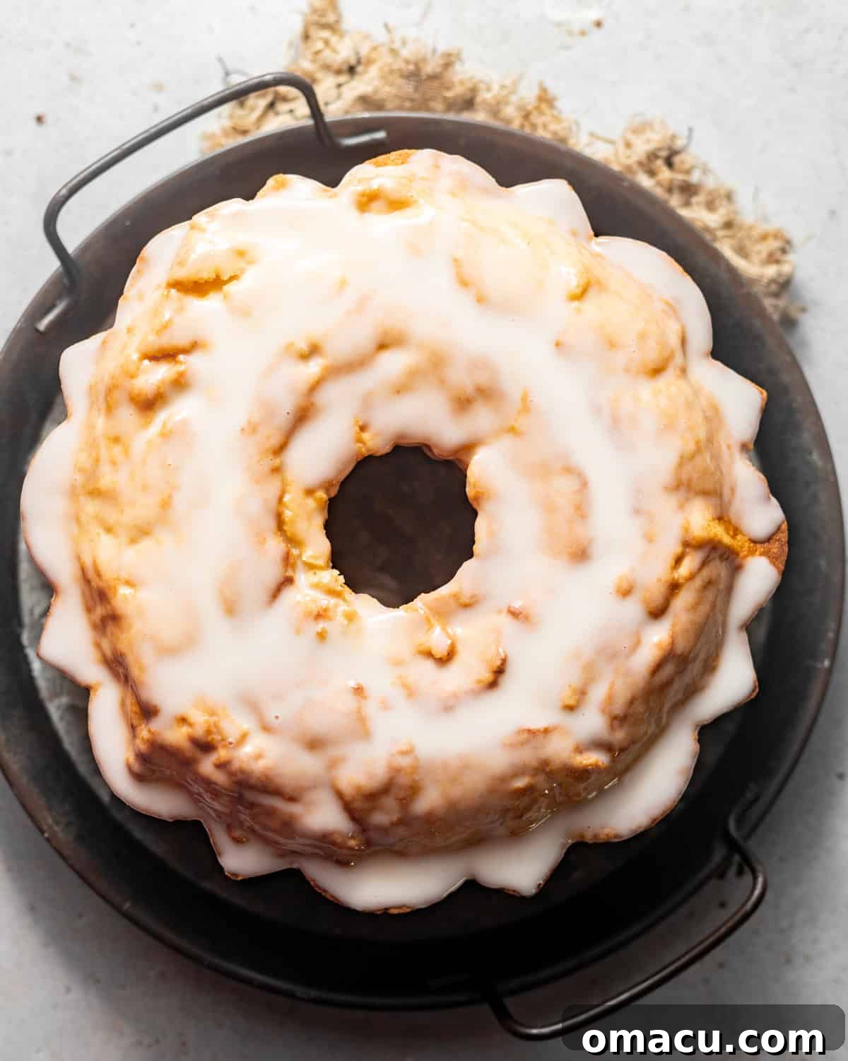 glazed donut cake on a serving board.