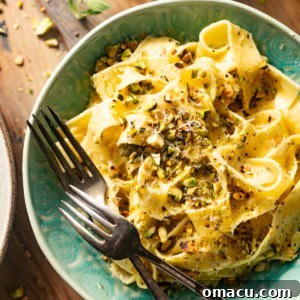 lemon caper pasta in a bowl with forks.