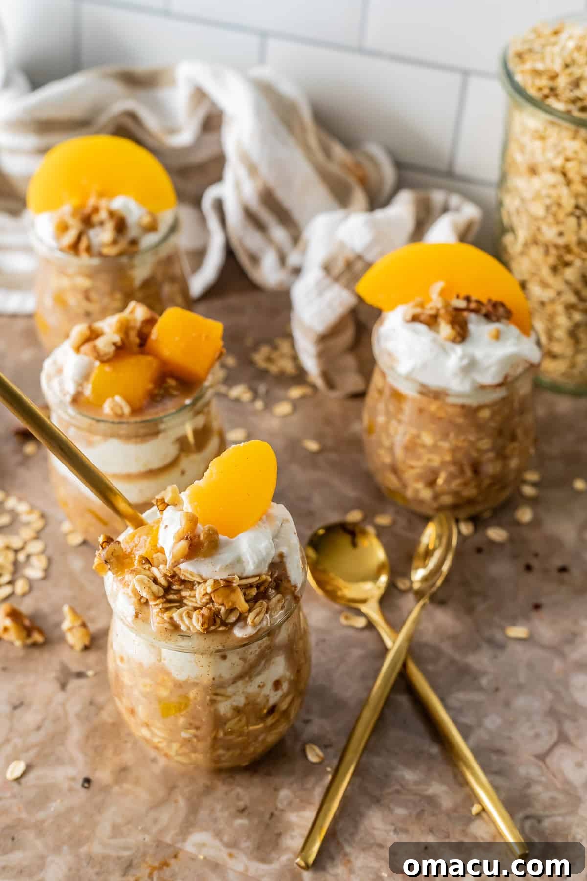 Overnight Oats layered in a clear jar with fruit, ready to eat.