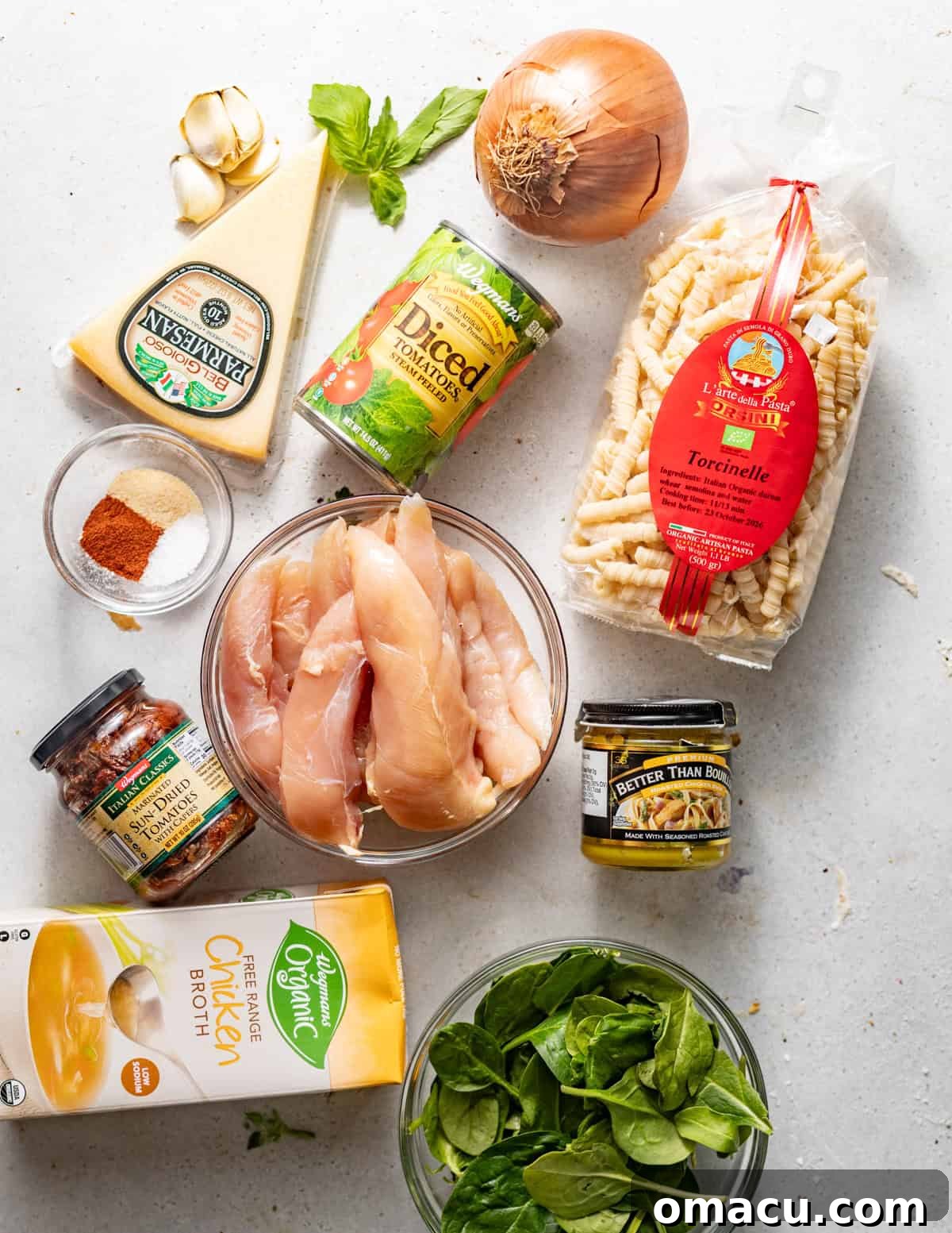 Ingredients laid out on a white surface for Marry Me Chicken Soup preparation.