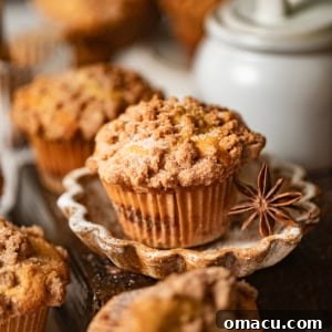 Coffee cake muffins on a plate with a star anise pod.