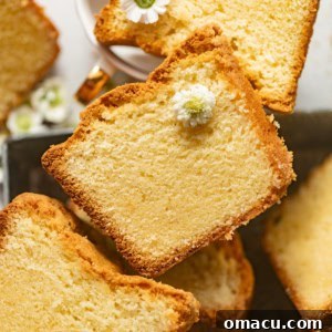 overhead photo of sliced white chocolate cake laid flat on a serving tray.