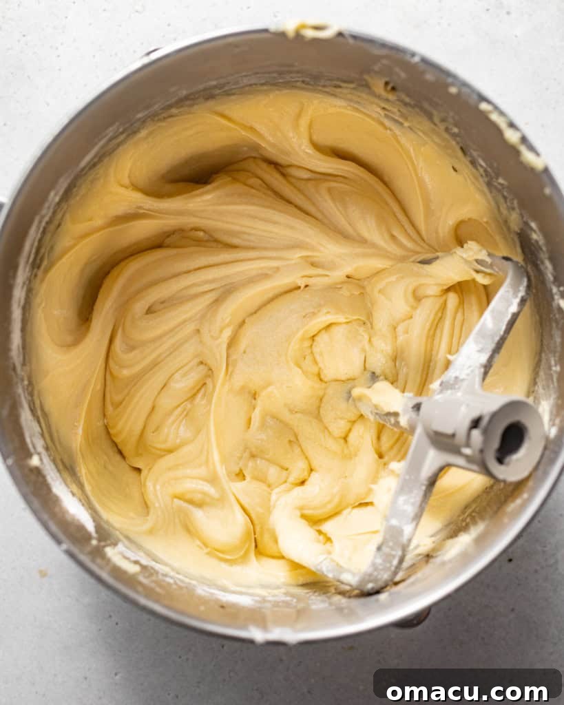 pound cake batter in the bowl of a stand mixer.