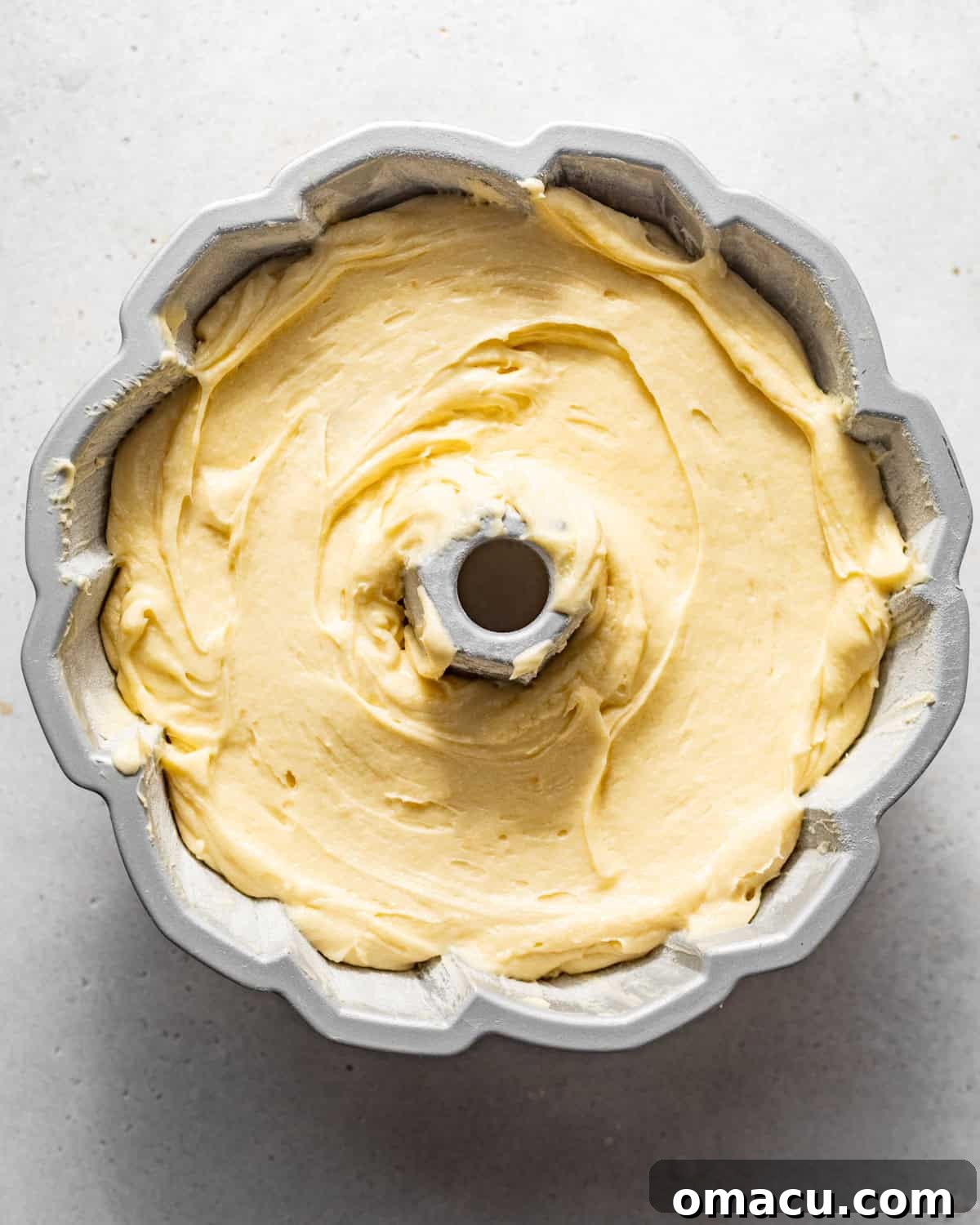 pound cake batter in a bundt pan.