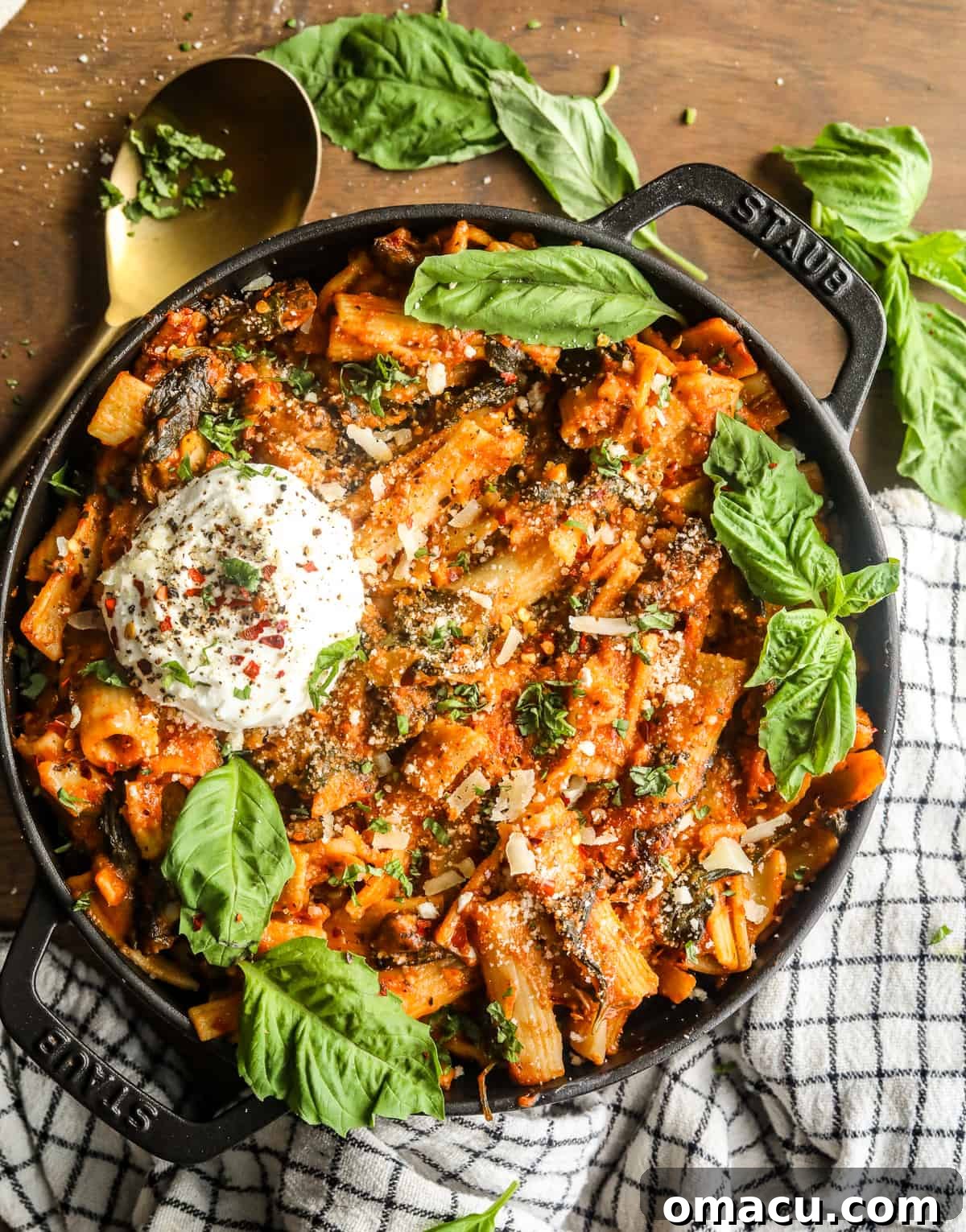 One Pot Creamy Tomato Pasta with Spinach and Mushrooms in a large dutch oven, ready to be served.