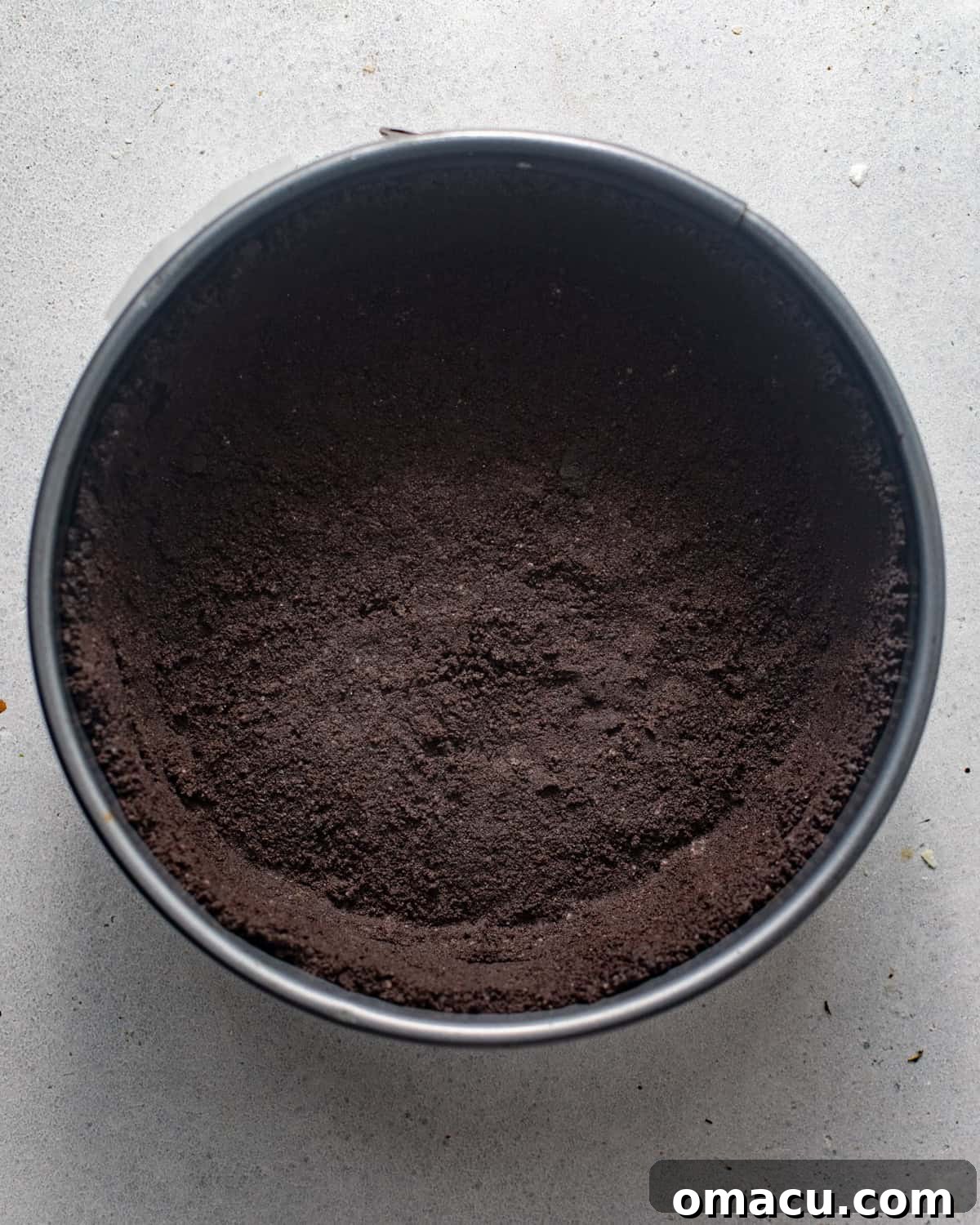 oreo cookie crust in a springform pan. 