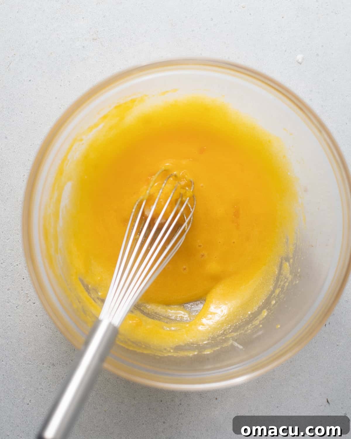 egg yolks, sugar, and kosher salt whisked together in a bowl. 