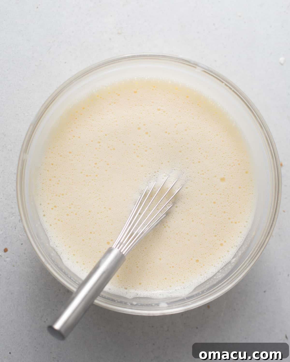hot cream added to the egg yolk mixture. 