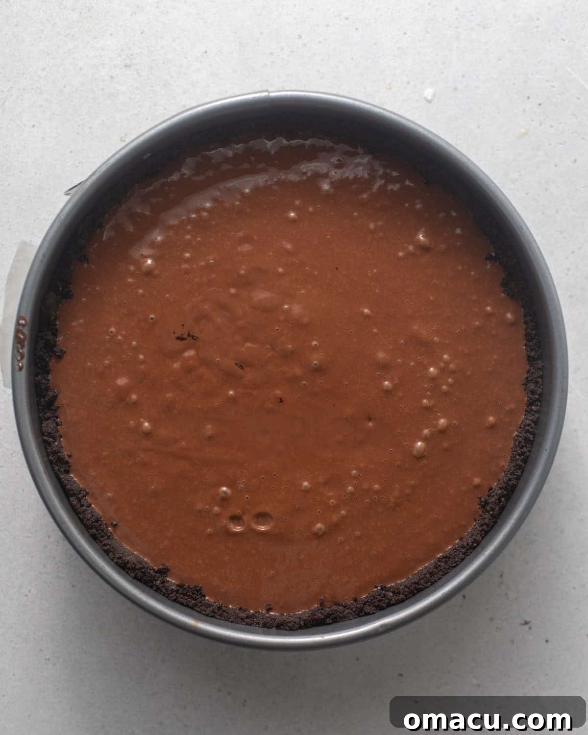 mousse filling poured into the oreo cookie crust to set in the refrigerator.