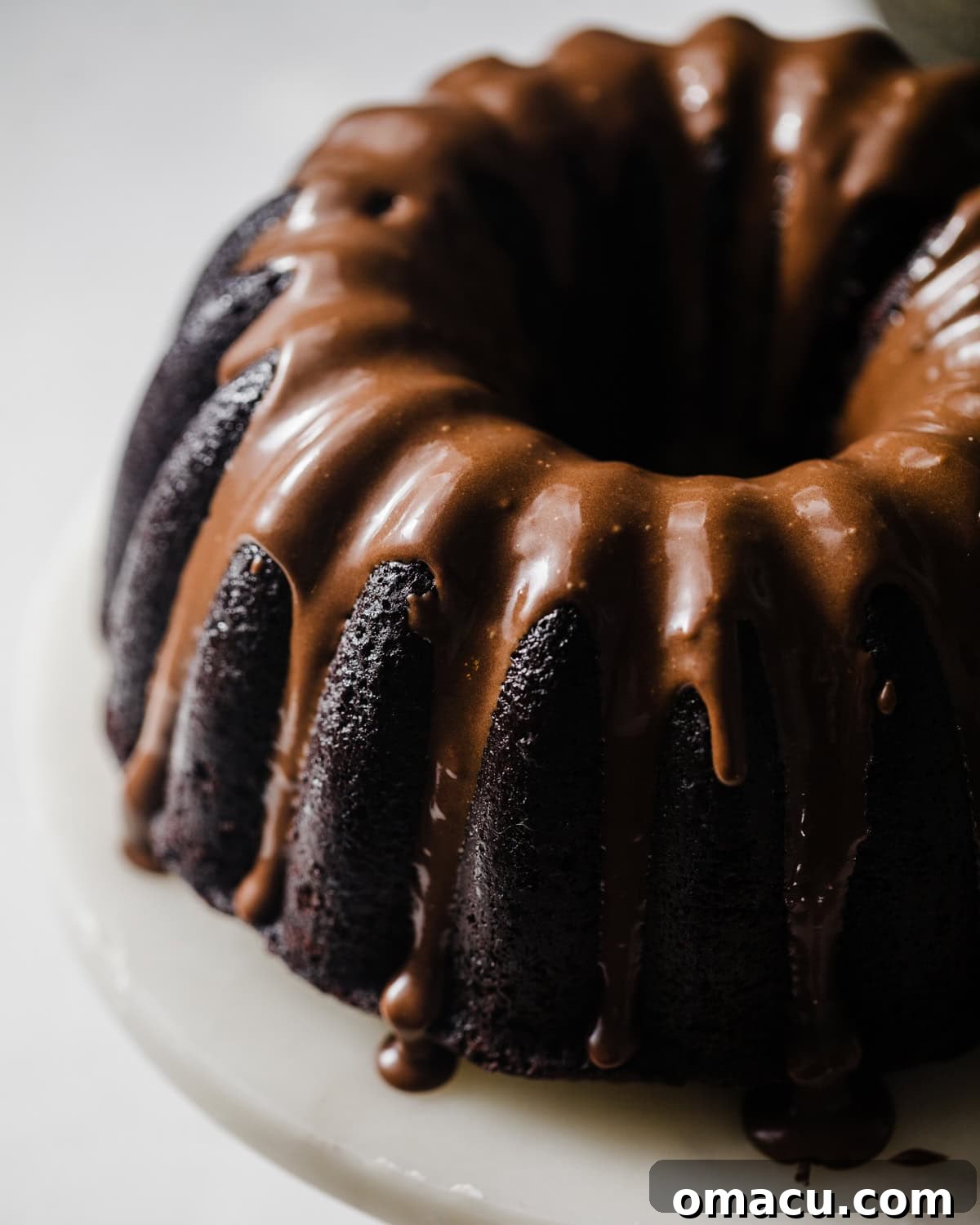 Close-up of the fully glazed chocolate donut cake, showcasing its rich texture and irresistible chocolate topping, perfect for any occasion.