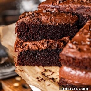 A stunning slice of chocolate cake with chocolate mousse on a cake stand, ready to be enjoyed.