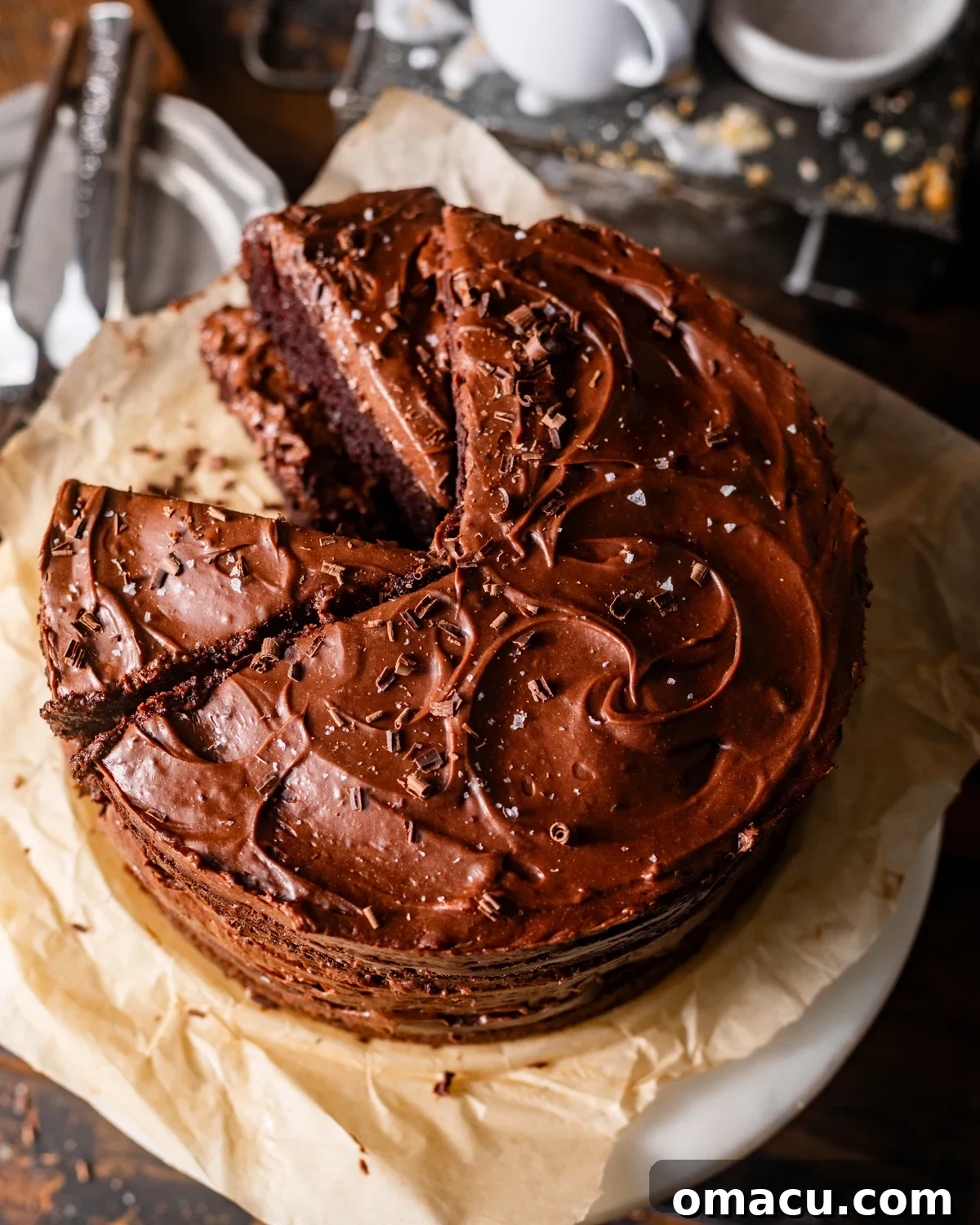 An inviting overhead photograph of the decadent chocolate mousse cake, elegantly presented on a cake stand.