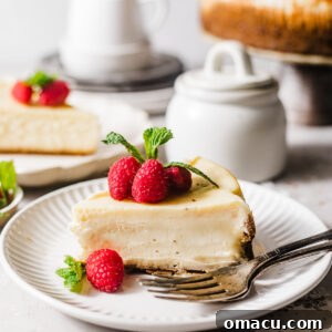 Slices of mascarpone cheesecake beautifully arranged on plates with forks.