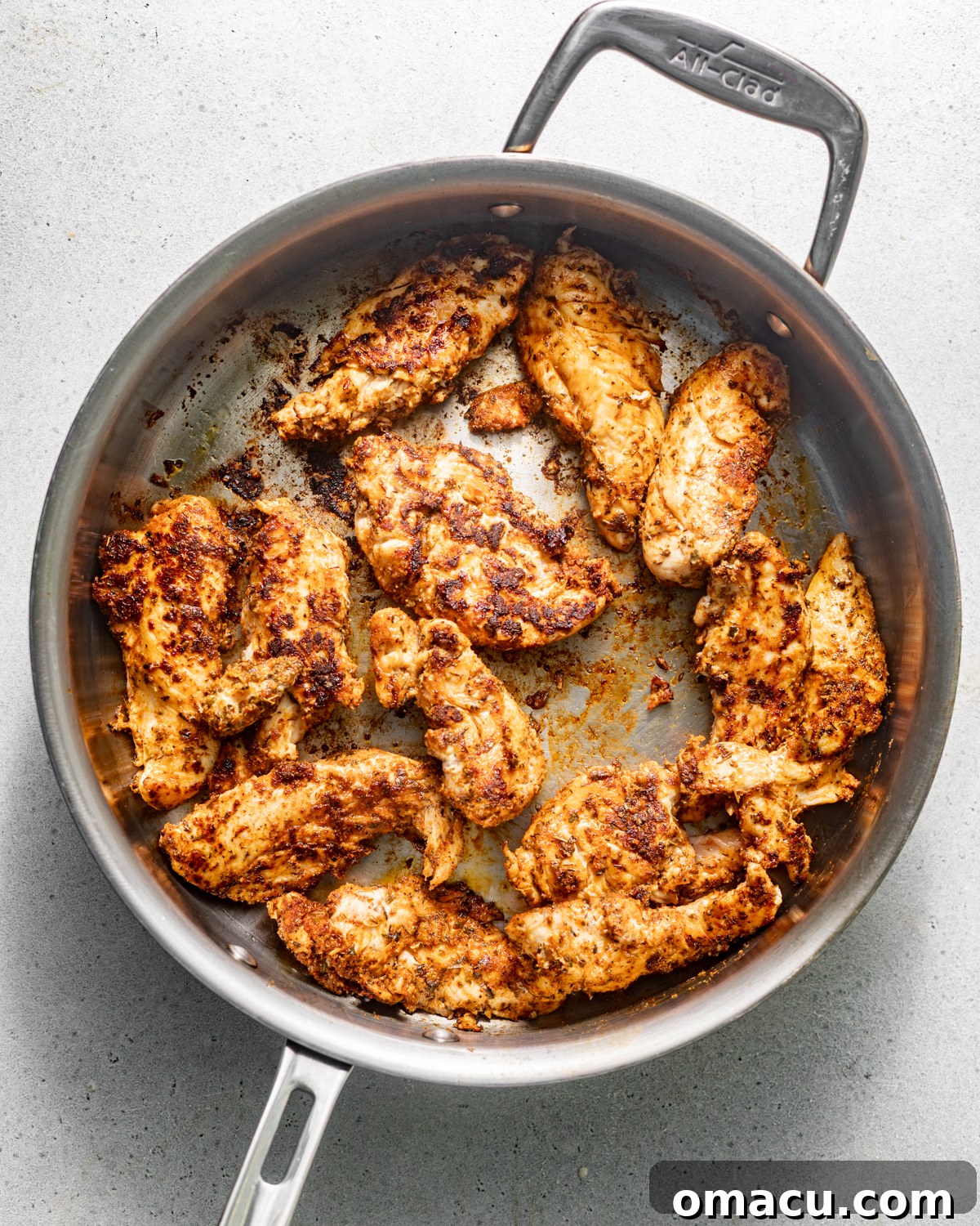 seared chicken in a skillet.