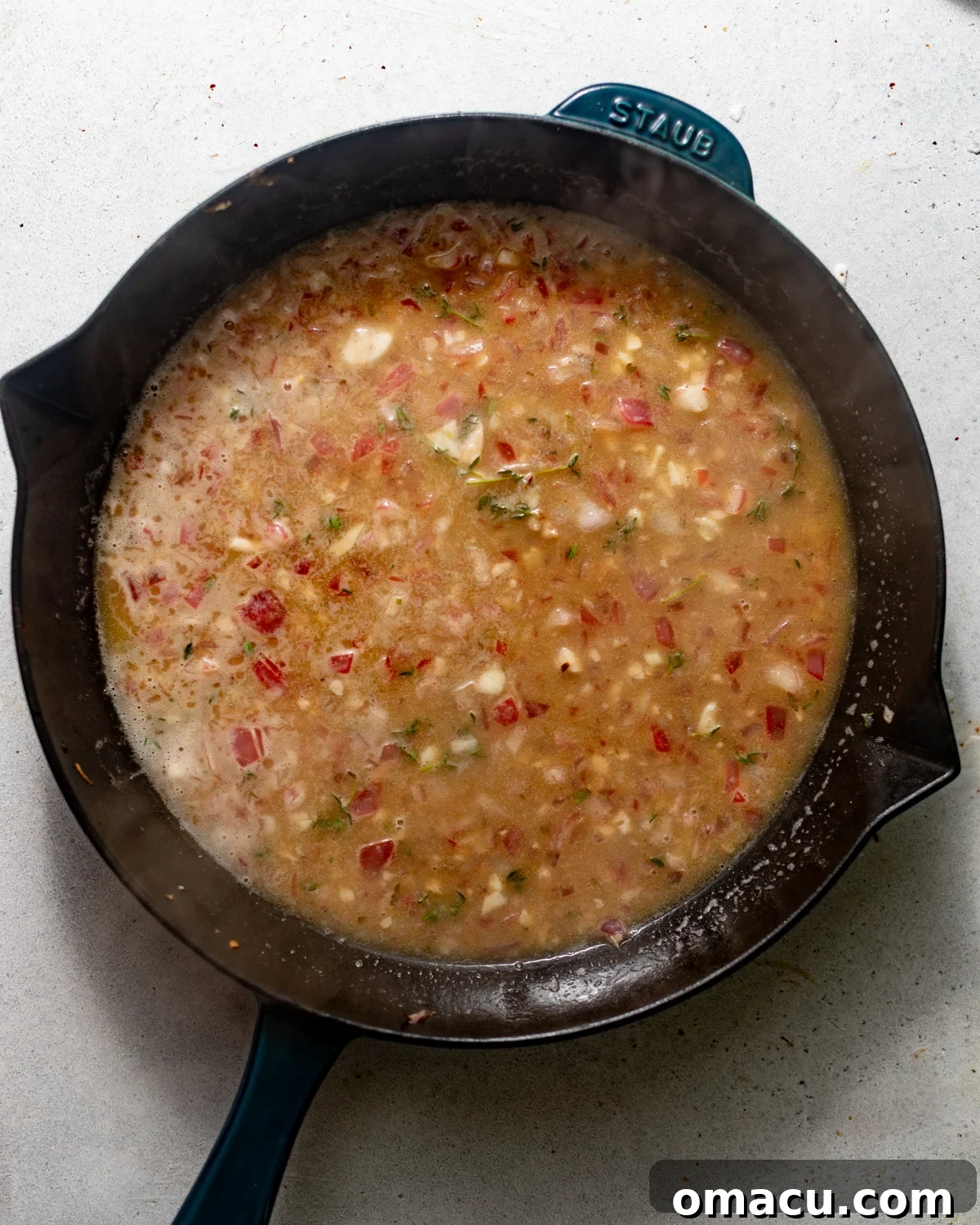 piccata sauce in a skillet.
