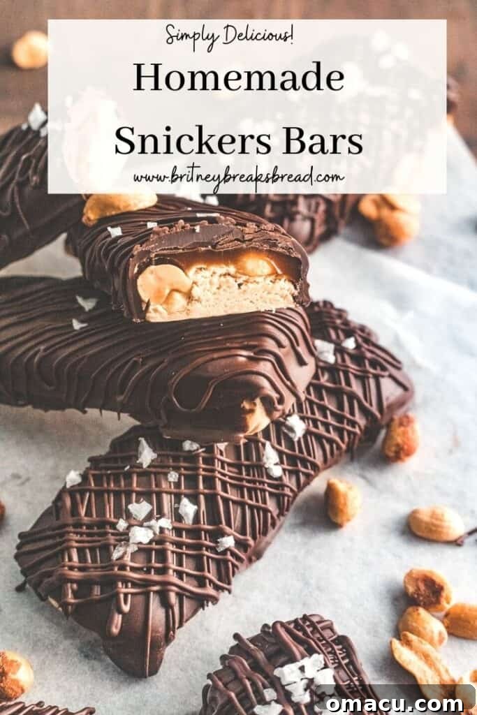 Pinterest pin for homemade Snickers bars, encouraging users to save the recipe.