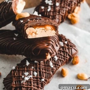 Homemade Snickers Bars displayed on a serving plate.