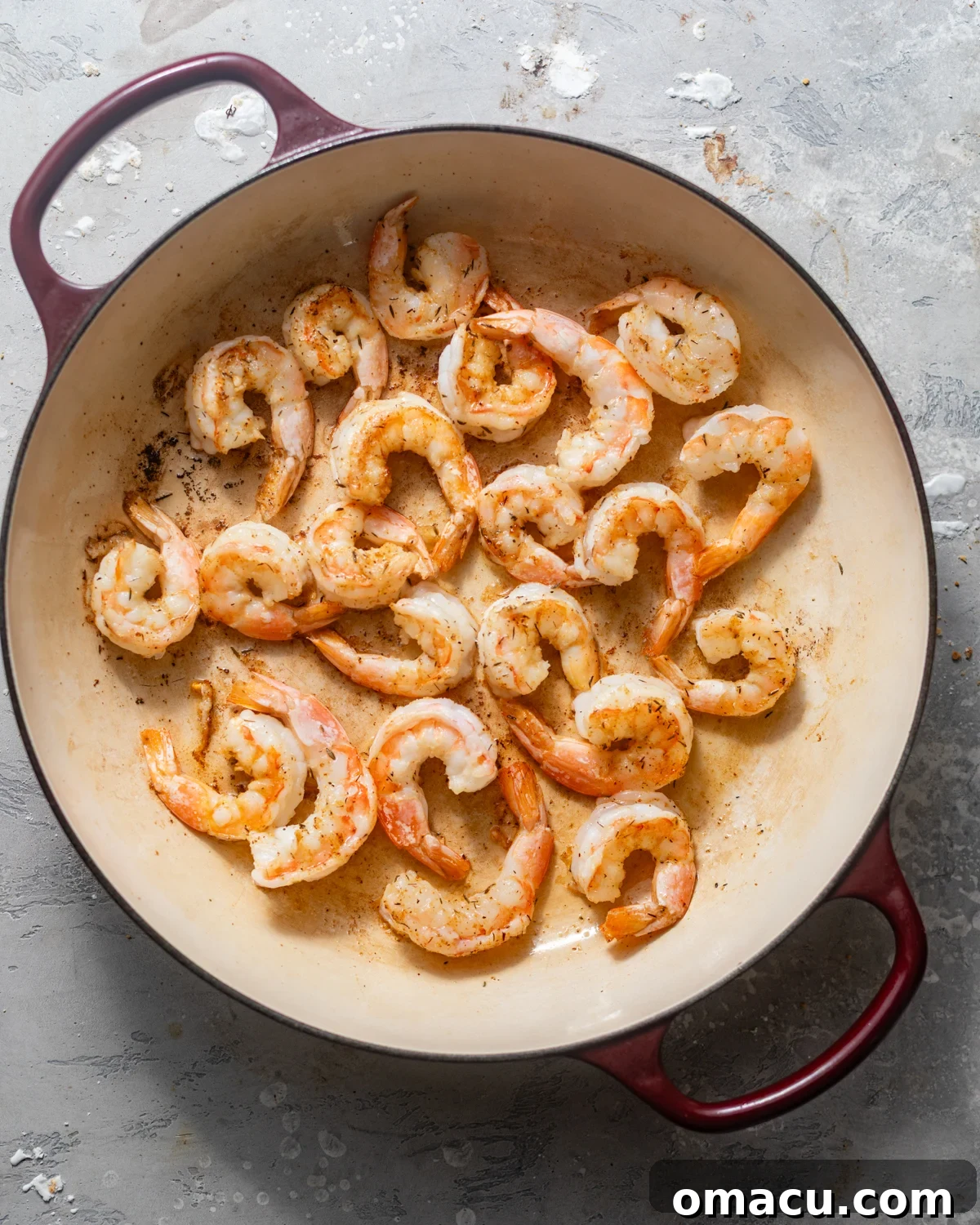 seared shrimp in a large skillet.