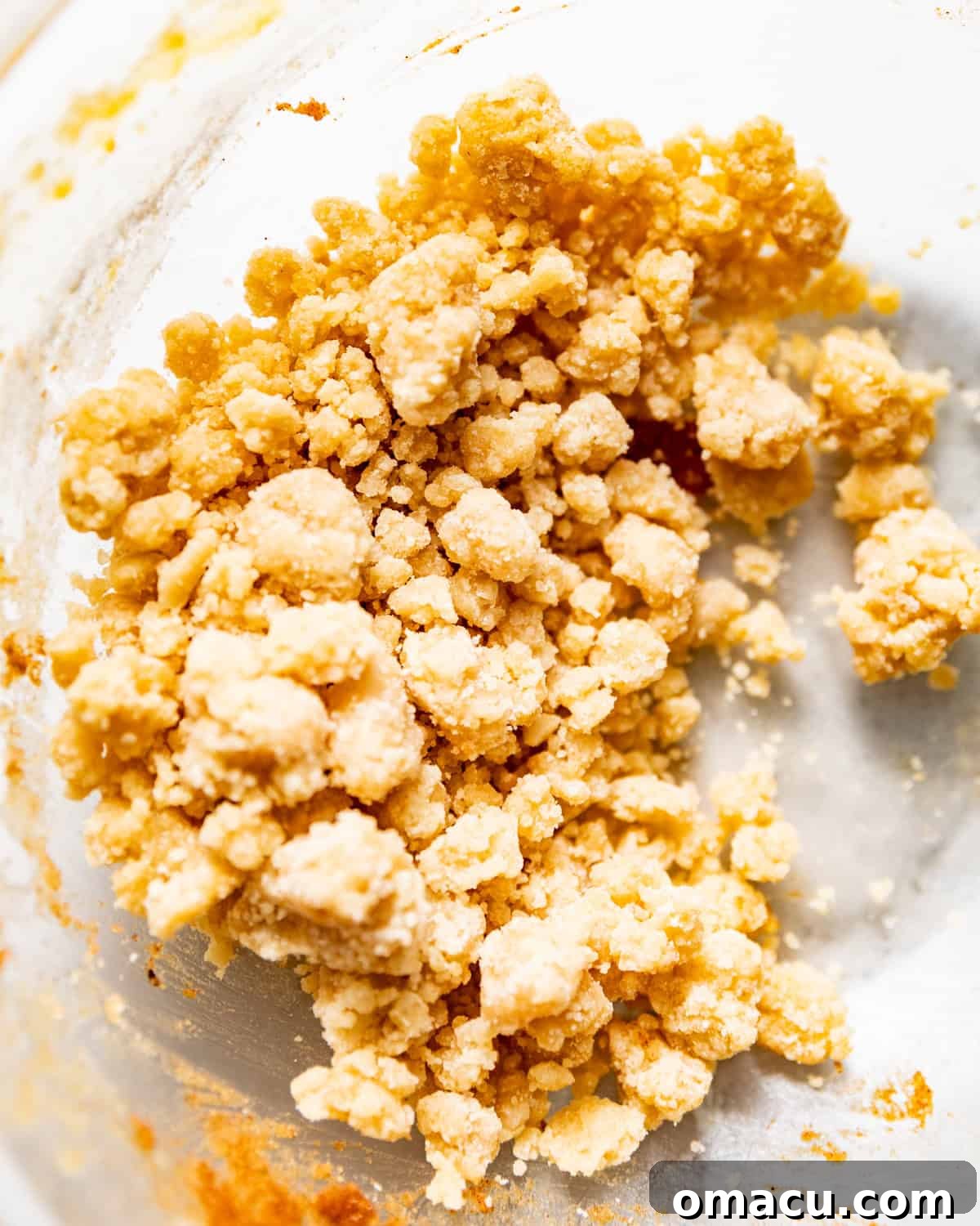 Crumb topping mixed together in a bowl, showing its crumbly texture.