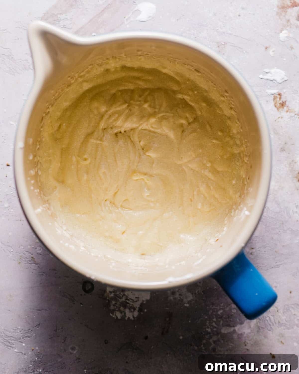 Creamed butter, vegetable oil, and sugar in a mixing bowl, light and fluffy.