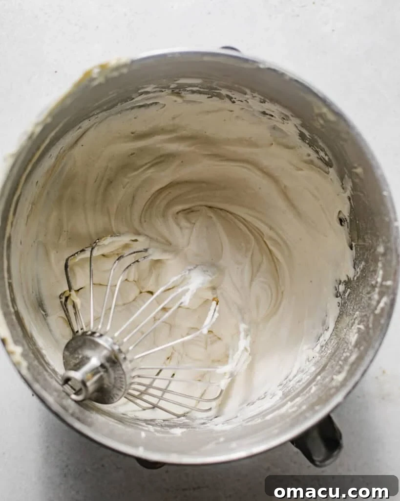 Creamy cannoli ricotta filling perfectly mixed together in a stand mixer bowl, ready for chilling.