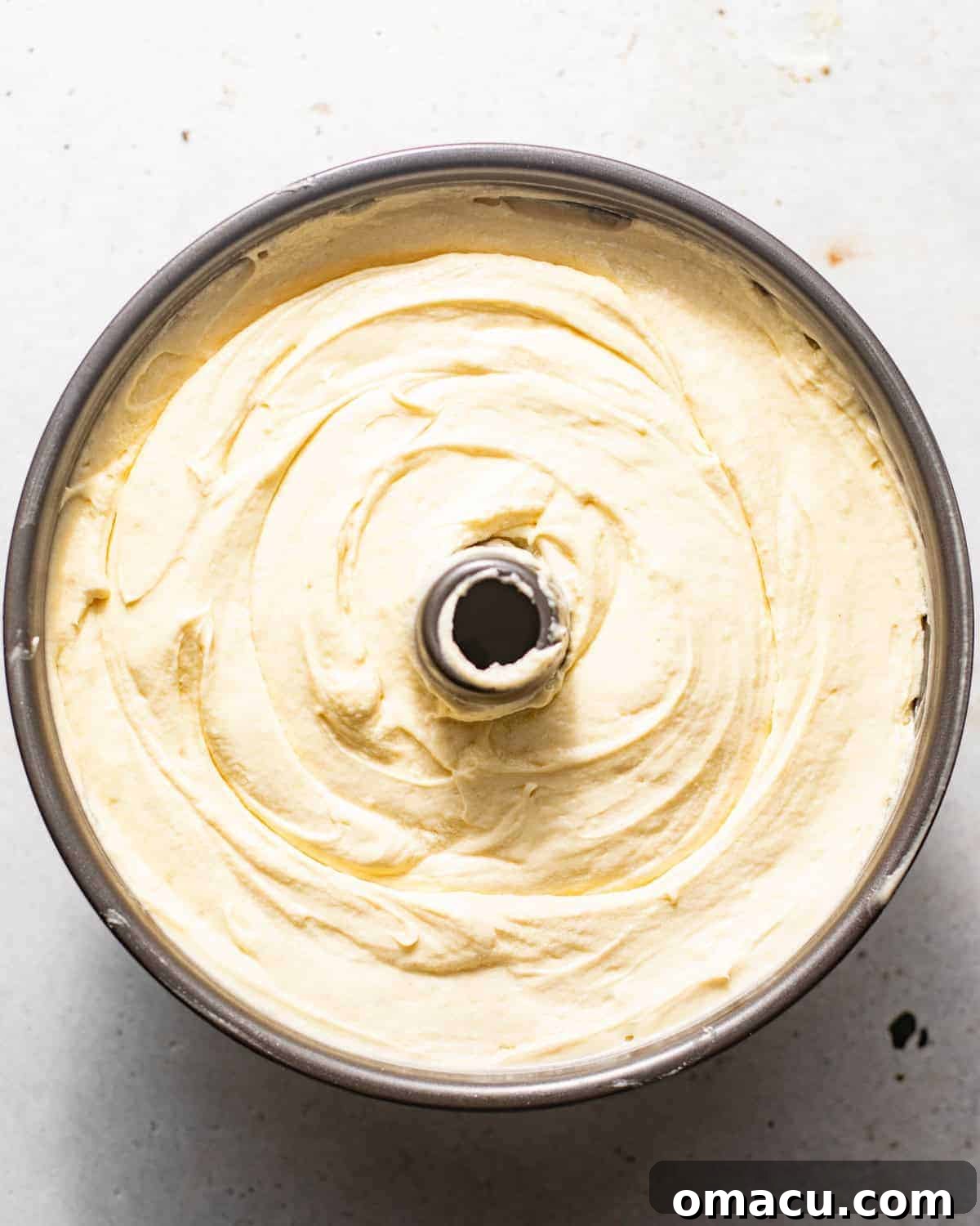 Key lime pound cake batter in a tube pan.