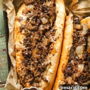 up close photo of philly cheesesteaks on a plate.