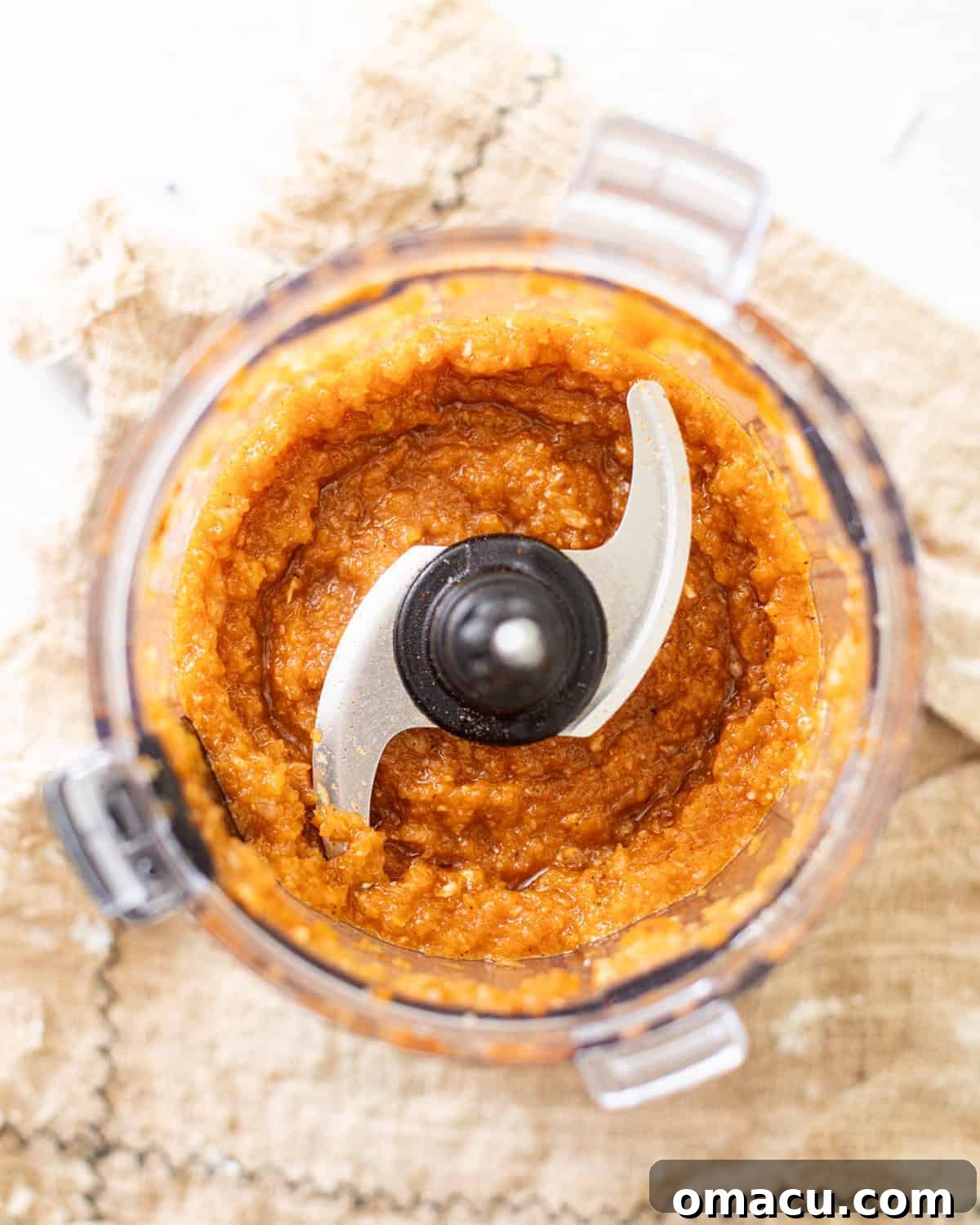 onions, garlic, hot sauce, and seasonings in a food processor.