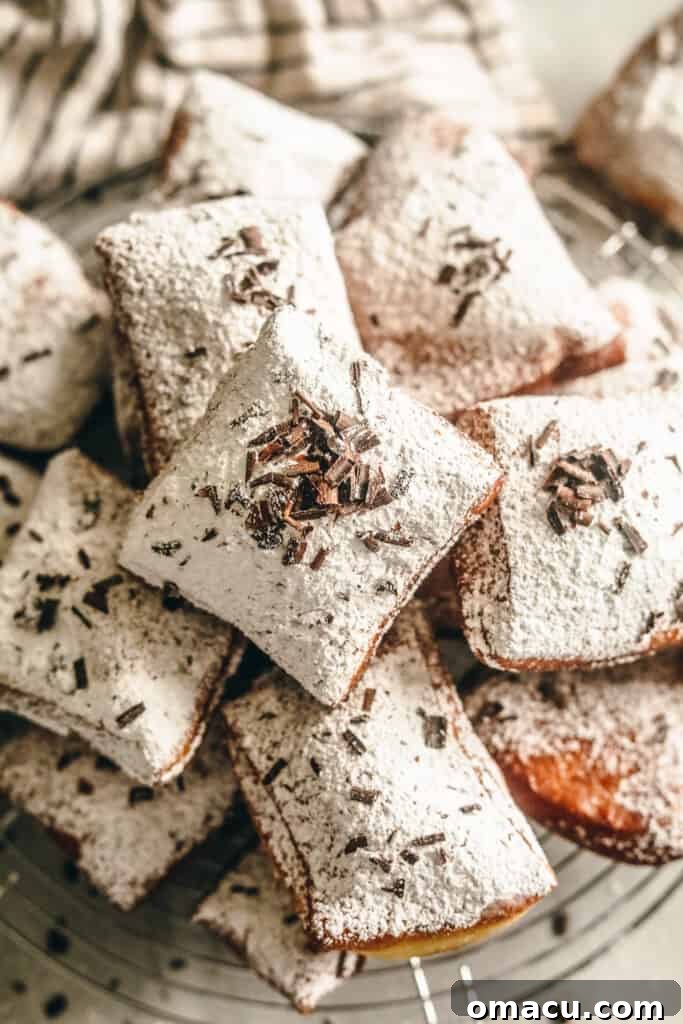 new orleans style beignets on a cooling rack