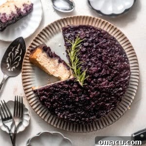 A delightful blueberry upside down cake on a serving plate, ready to be enjoyed.