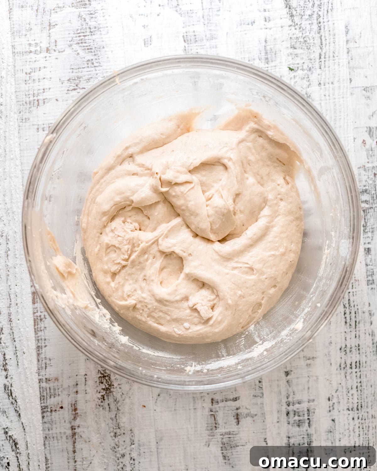 A smooth, perfectly mixed cake batter in a bowl, ready for the next step.