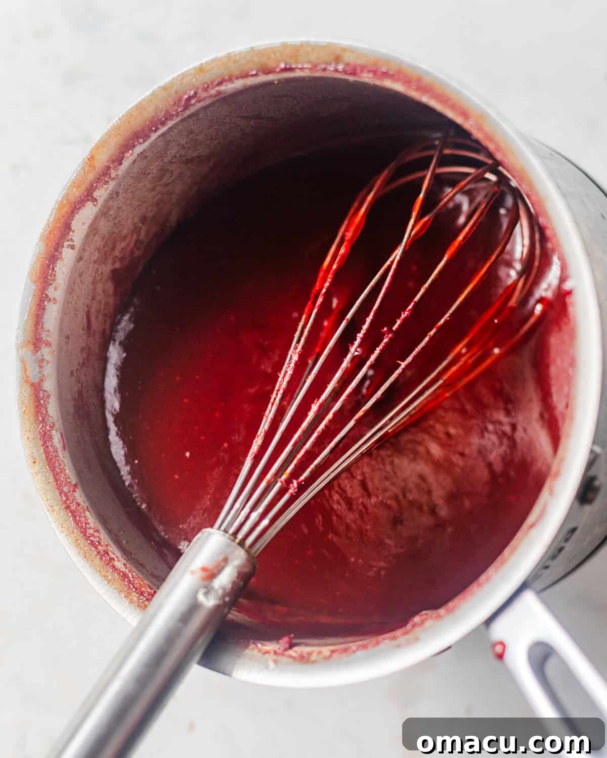 sweet and sour sauce in a whisk. 