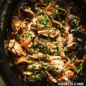 overhead photo of slow cooker pork roast in a slow cooker.
