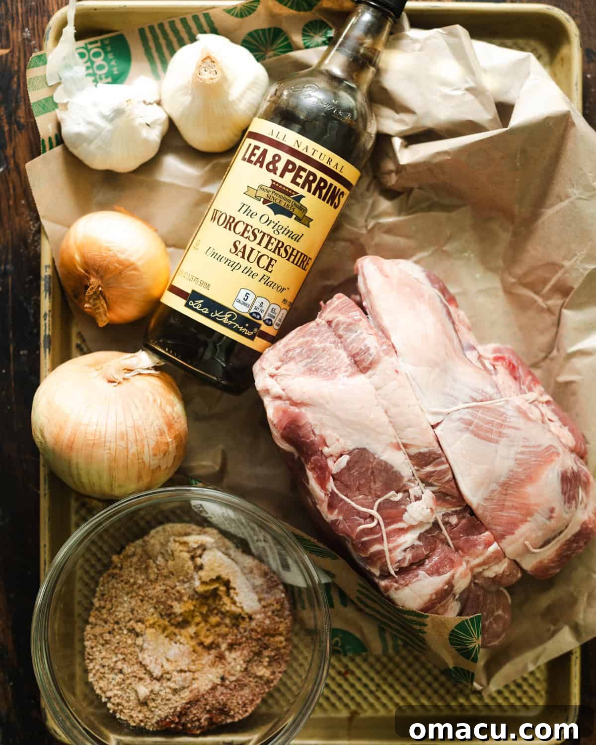 ingredients to make a slow cooker pork roast in a baking tray.