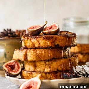 Perfectly cooked Sourdough French toast, glistening with maple syrup and garnished with fresh sliced figs.