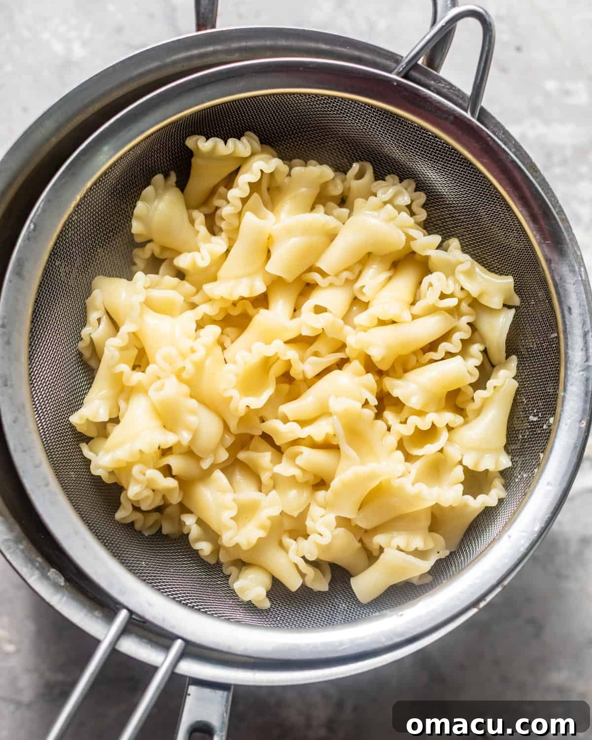 boiled pasta drained in a pot.