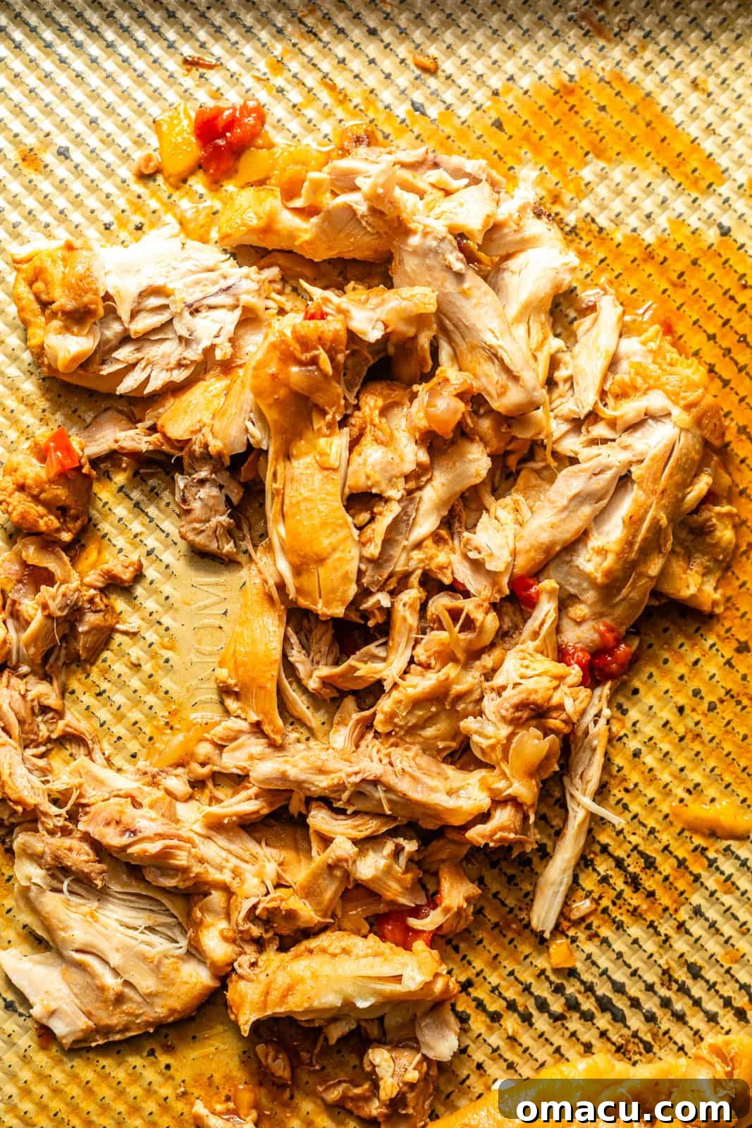 shredded chicken on a baking tray. 
