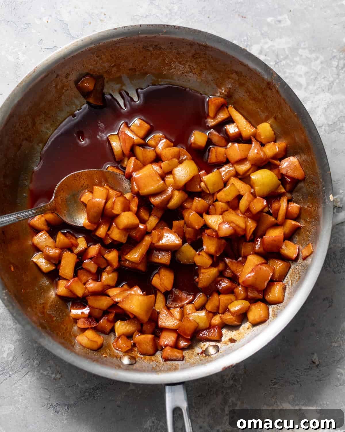 cooked apple pie filling in a skillet.