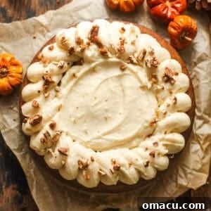 overhead photo of pumpkin olive oil cake on a piece of parchment paper.