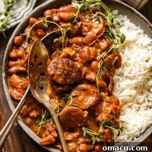 overhead photo of cajun red beans and rice in a bowl with a spoon.