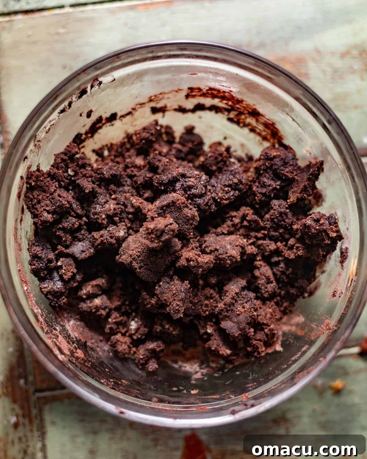 Chocolate streusel mixture in a mixing bowl.