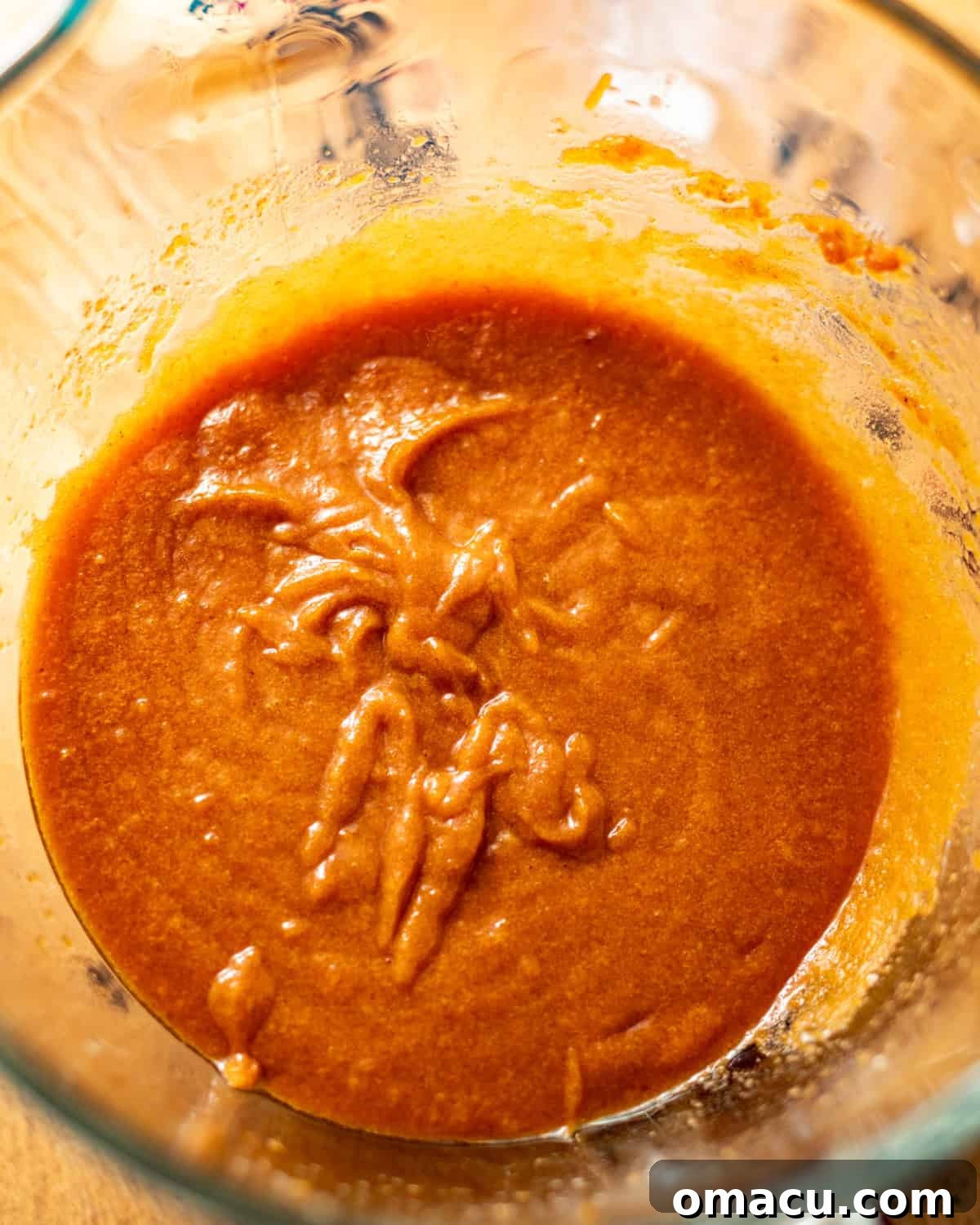 Wet ingredients whisked together in a glass bowl until smooth.